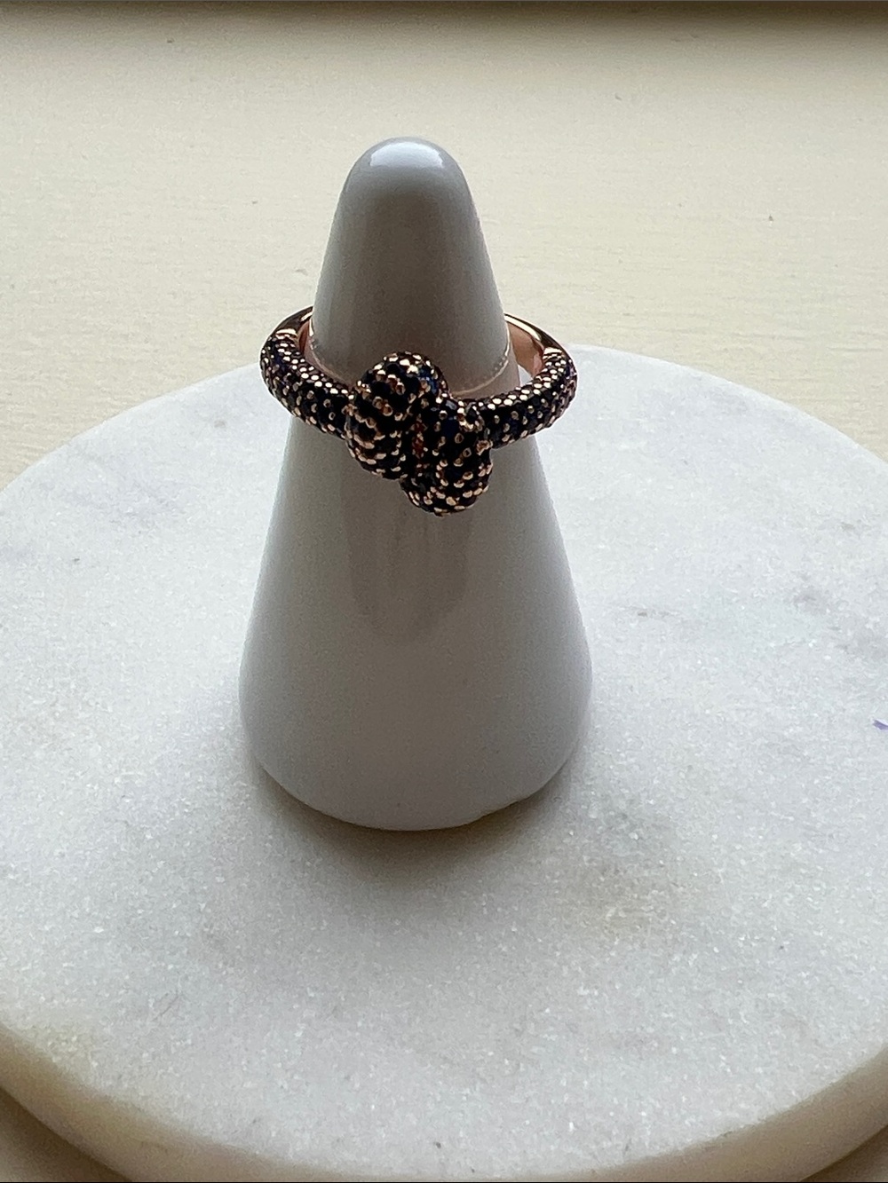 bp September birthday Rose Gold Knot Ring with blue Stones